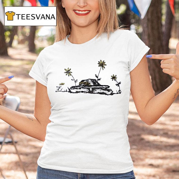 The Tenacious Vitality Of Flowers Growing On An Old Tank T Shirt The Tenacious Vitality Of Flowers Growing On An Old Tank T Shirt