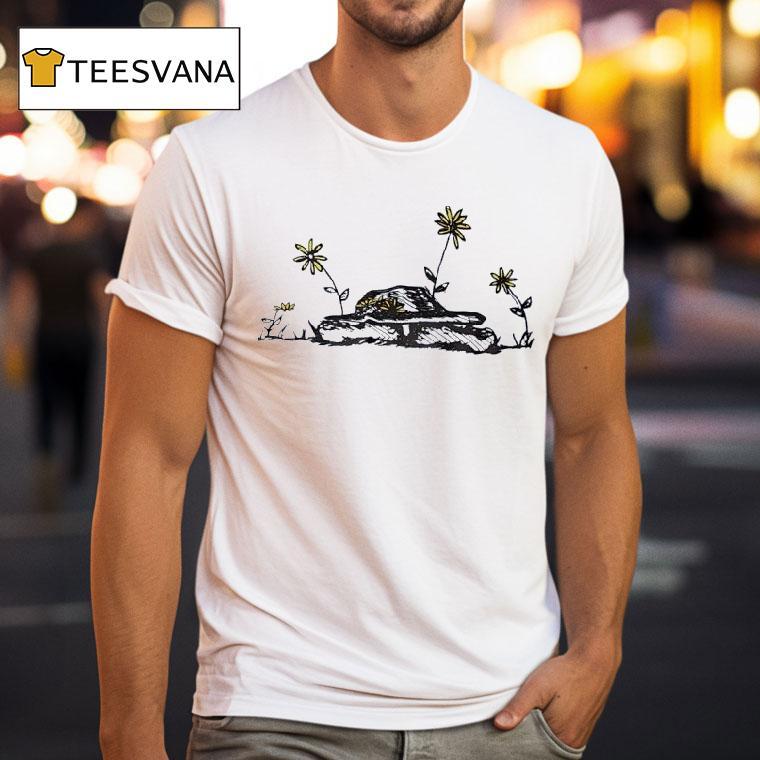 The Tenacious Vitality Of Flowers Growing On An Old Tank T Shirt The Tenacious Vitality Of Flowers Growing On An Old Tank T Shirt